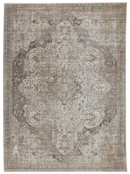 Vintage style rug with distressed medallion pattern in gray, ivory, tan, and taupe hues