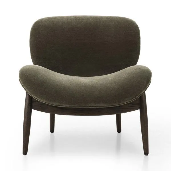 Olive green velvety chenille accent chair with wide curved seat and back, tapered dark wooden legs