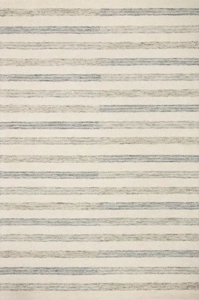 Chris Ivory Slate Rug with soft beige base and multi-tonal horizontal stripes in blue, gray, and taupe