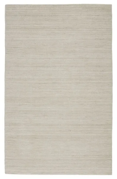 Handwoven low-profile indoor/outdoor rug in solid heathered ivory and light gray polyester weave