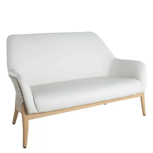 Compact natural wicker loveseat with light wood frame and plush white vinyl cushions, rounded back and arms