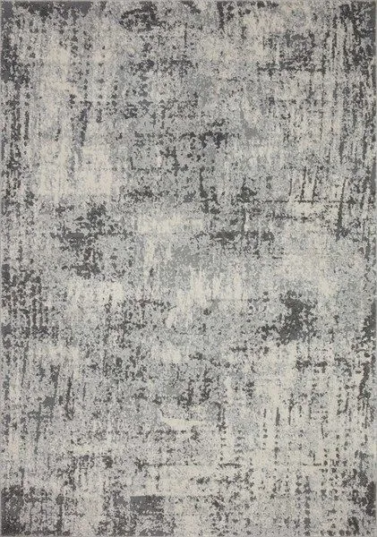 Charcoal rug with a muted, abstract pebble pattern in shades of gray and off-white