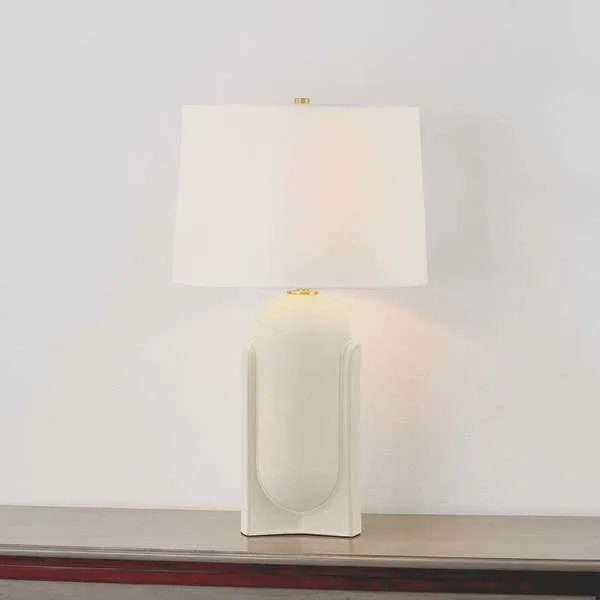 Leeston table lamp with oblong pill-shaped matte ceramic base in soft cream and simple white fabric shade