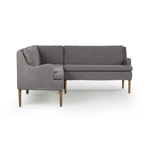 L-shaped dining banquette with curved arms, high back, gray flax linen upholstery, and tapered wood legs