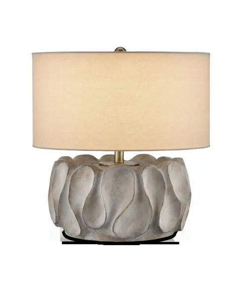 Weststrand Table Lamp with rugged gray cast concrete base featuring organic spoon-like swells and a beige drum shade