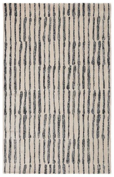 Hand-tufted modern area rug with abstract vertical black lines on cream background, bold slate gray and cream contrast