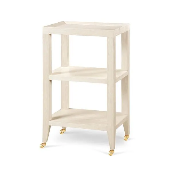 Isadora Side Table with light wood finish, three-tier shelves, tapered legs, and brass caster wheels