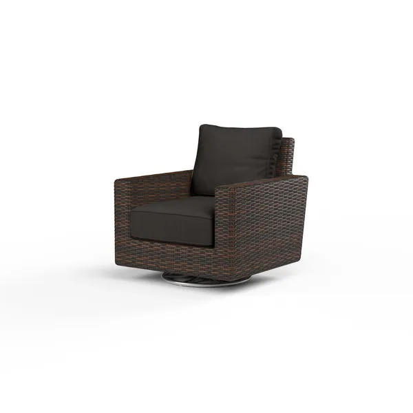 Montecito swivel rocker club chair with rich Cognac multi-colored resin wicker and dark cushions on a round metal base