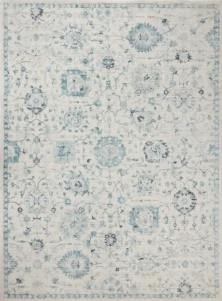 Marcella Blue/Ivory Rug with traditional floral and geometric motifs in blue and ivory tones, featuring distressed detailing