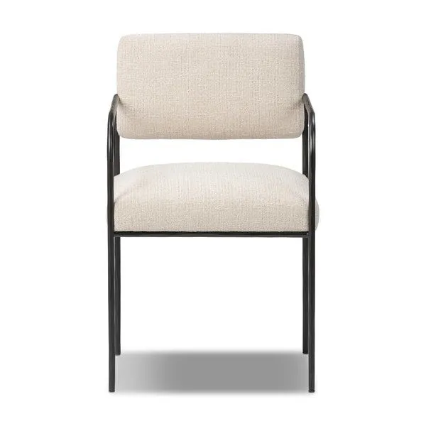 Fenn Dining Chair with slim hammered black iron frame, squared cream-colored upholstered seat and bolster back