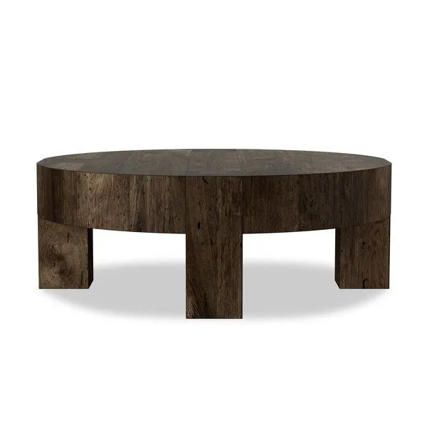 Round coffee table with thick-cut oak veneer and faux rustic wormwood oak finish featuring chunky square legs and dovetail...